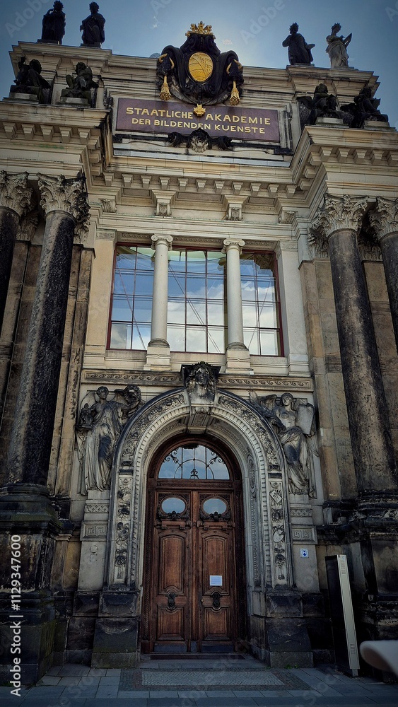 the majestic facade of the academy with elements of classical architecture. Large columns and sculptures decorating the entrance the majestic facade of the academy with elements of classical architecture. Large columns and sculptures decorating the entrance
