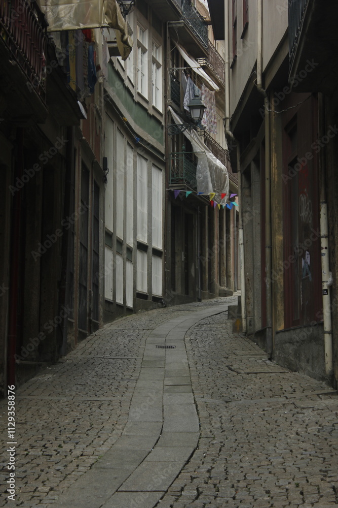 Dark mysterious alley and street with colored flags Dark mysterious alley and street with colored flags