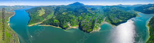 Aerial View of Lush Green Landscape with Mountain and Lake