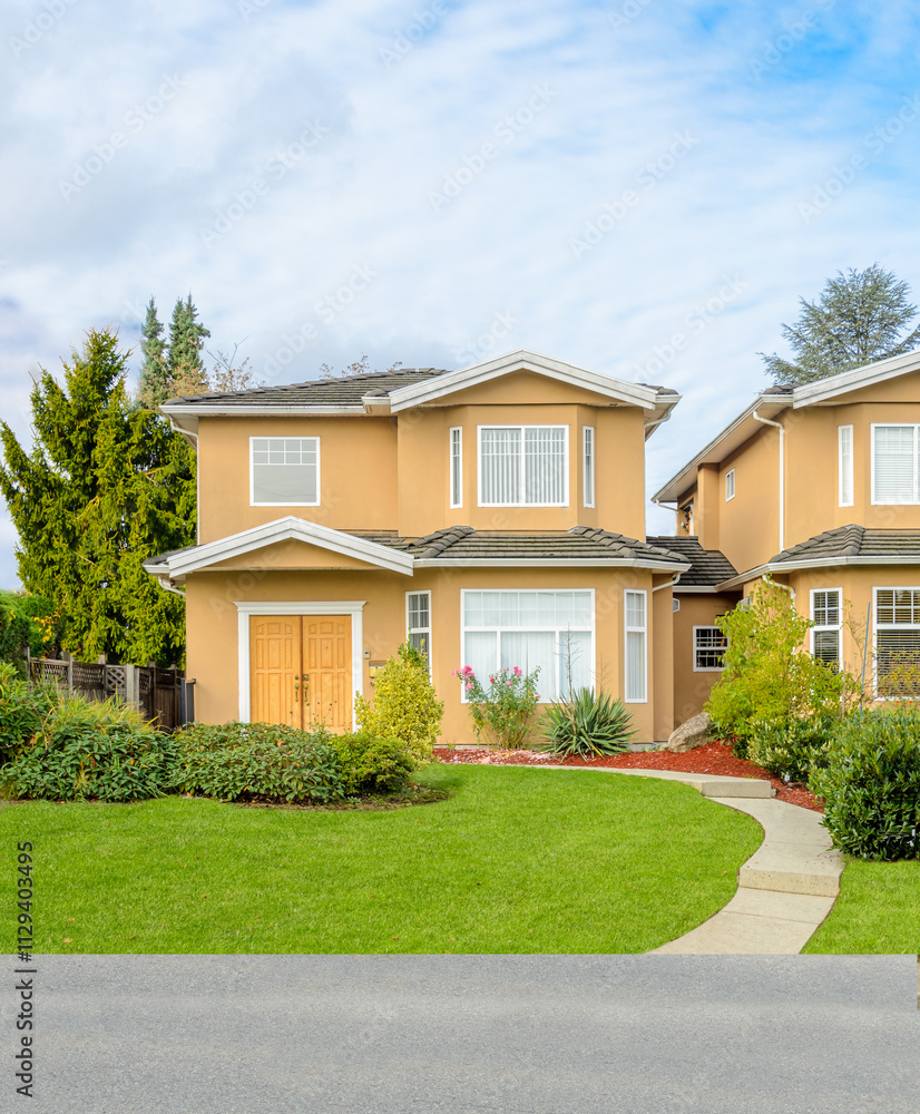 Two story stucco luxury house with nice summer landscape in Vancouver, Canada, North America. Day time on June 2024. Two story stucco luxury house with nice summer landscape in Vancouver, Canada, North America. Day time on June 2024.