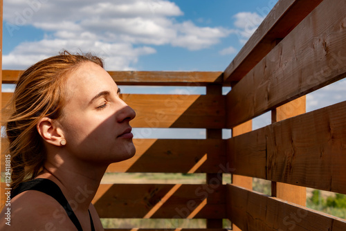 Young woman on a lookout-tower photo