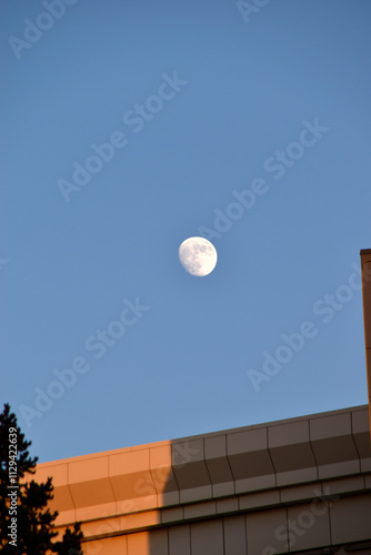 The moon in the sky and the administrative building.