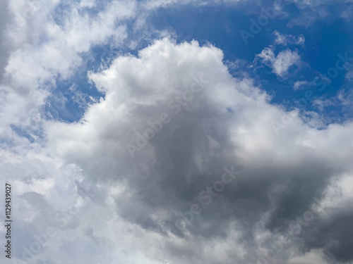 Big clouds floating in the sky Forming together into rain clouds in the afternoon