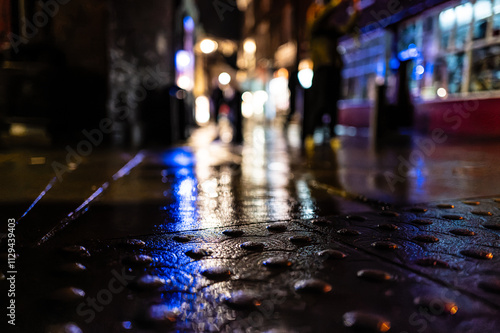 Obraz na plátně Ground level view of a rain soaked pavement in the historic town of York, UK