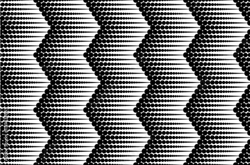 Seamless abstract background with black halftone dots. Monochrome chevron pattern.