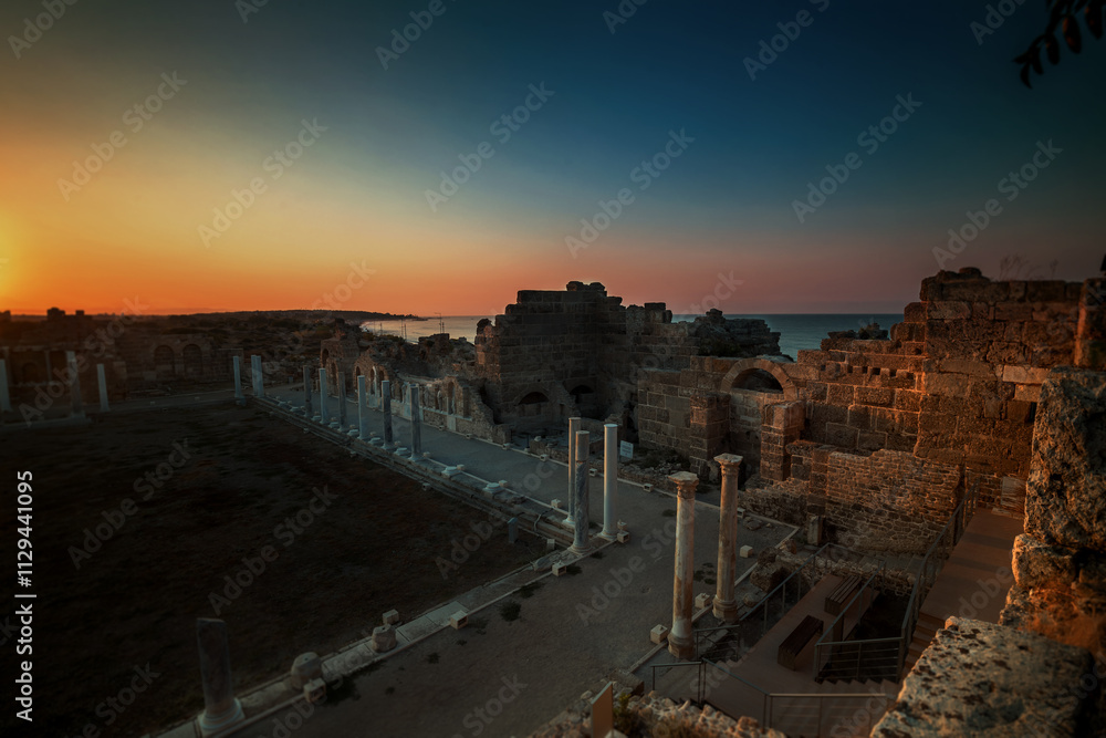 Fototapeta premium View of ancient ruins at sunrise in Side, Turkey.