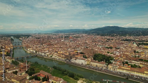 Florence, capital of Tuscany region. Home of Renaissance art and architecture. Aerial drone view iconic sight Duomo Cathedral of Santa Maria del Fiore with beautiful city landscape and Arno River photo