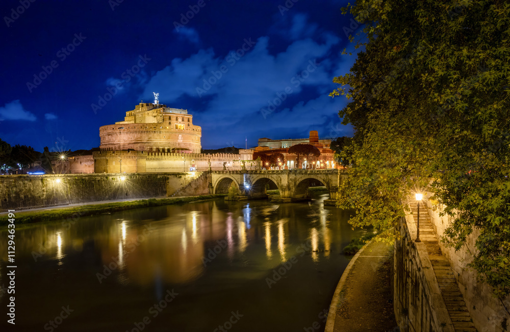 Fototapeta premium Ponte Sant'Angelo leads to Castel Sant’Angelo, also known as the Mausoleum of the Roman Emperor Hadrian, a fortress located on the right bank of the Tiber River, a short distance from Vatican City.