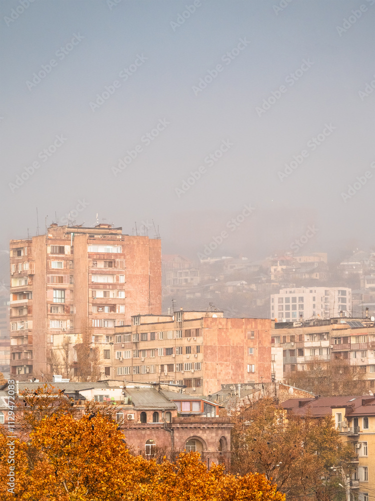 Fototapeta premium pink air in rain over apartment houses in autumn