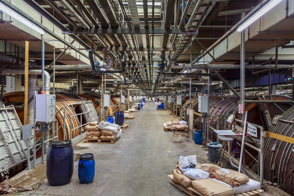 Drum machine for leather tanning in the factory workshop. Drum machine for leather tanning in the factory workshop.