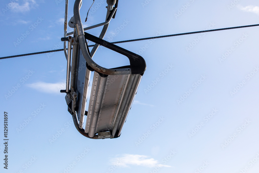 ski lift without people on a sunny day on the slope. Leisure. school break ski lift without people on a sunny day on the slope. Leisure. school break