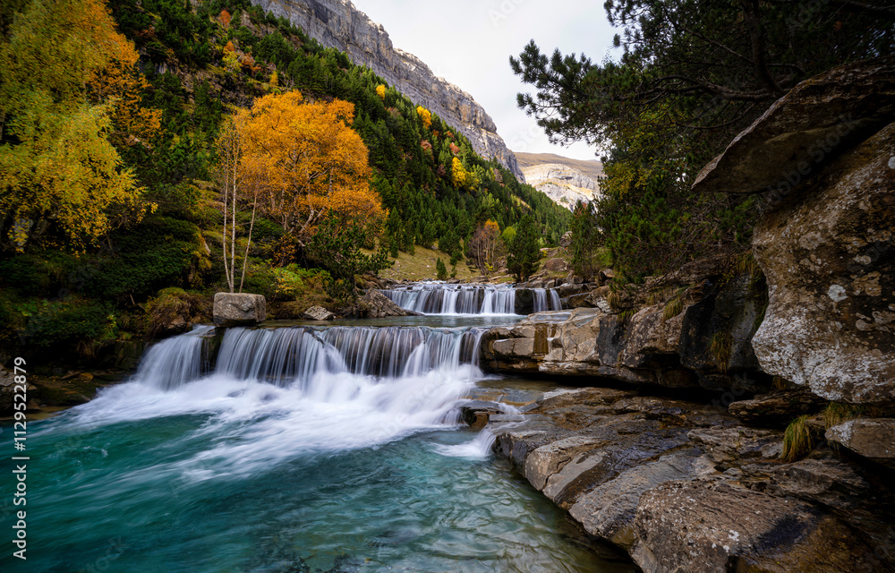 waterfall in autumn forest waterfall in autumn forest