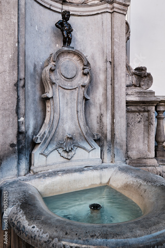  A view of the historic Manneken Pis sculpture in the city of Brussels, Belgium photo