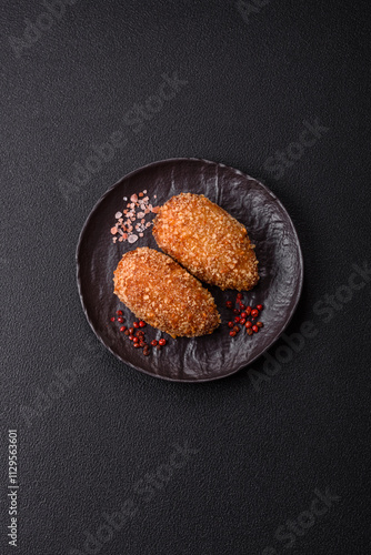 Delicious fresh cutlet or meatball Kiev style with filling photo