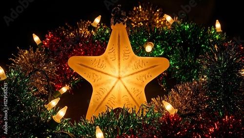 Festive Christmas star ornament with tinsel and string lights