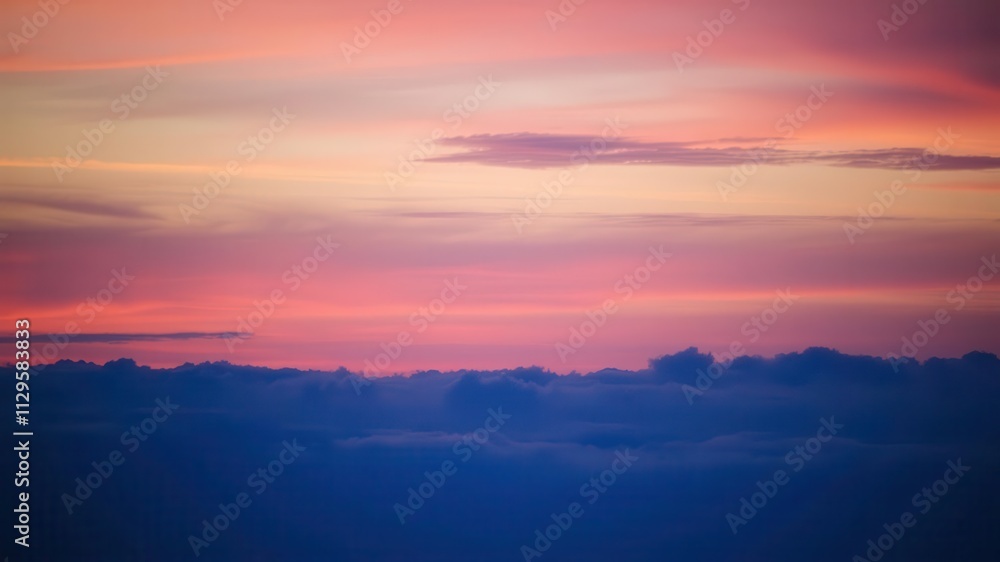 Vibrant orange and pink hues streak across the sky at sunset, creating a dramatic and abstract landscape, picturesque, twilight, evening Vibrant orange and pink hues streak across the sky at sunset, creating a dramatic and abstract landscape, picturesque, twilight, evening