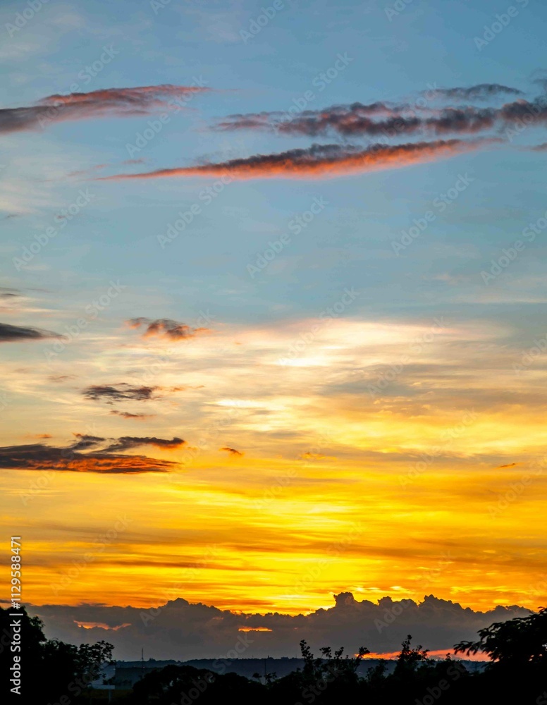 Fototapeta premium Sunrise with intense natural orange lights and idyllic dramatic scenery