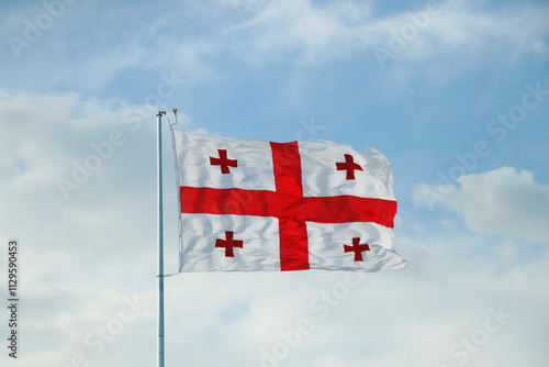 Canvas Print georgian flag waving in the sky with blue background