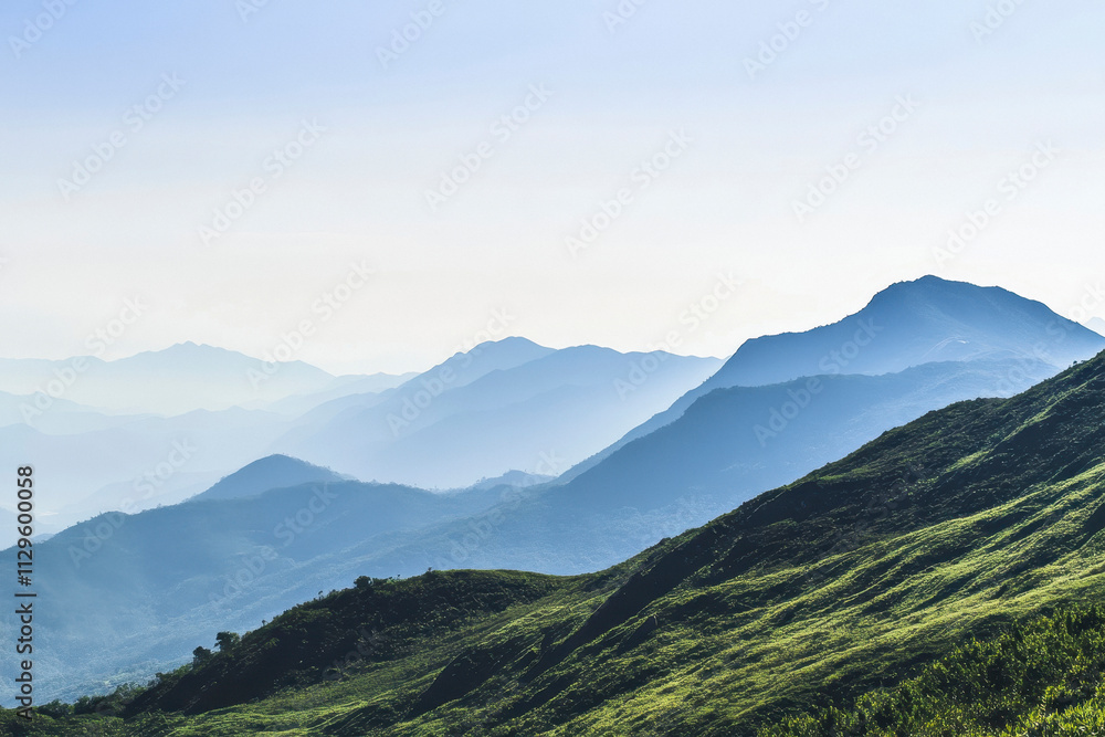 Fototapeta premium minimalist, photography, a minimalist mountain range with crisp lines and sparse vegetation, distant view.