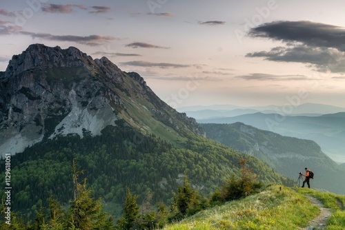 Photographer taking photo of a sunrise in Mala Fatra, Slovakia photo