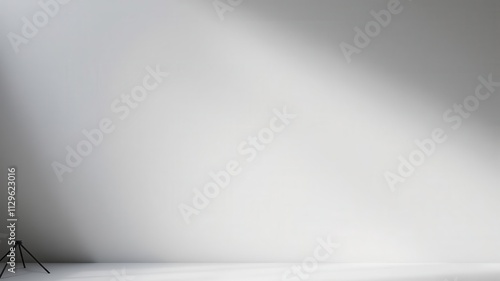 Gray background with soft, diffused lighting creating elegant shadows for product presentation, background, presentation photo