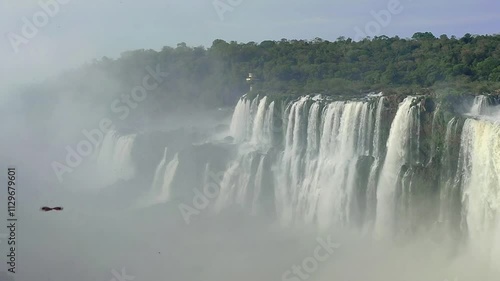 Beautiful rainbow that forms in a huge waterfall in Iguazú, Argentina. Beautiful rainbow that forms in the Devil's Throat in Iguazú Falls, Argentina