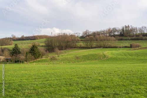 Panoramic landscape photo of German countryside in North Rhine Westphalia. Hills, forests and fields of Sauerland