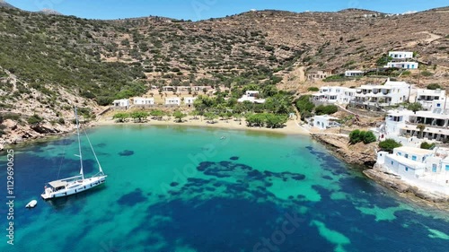 Aerial drone cinematic video of famous and picturesque seaside fishing village and beach of Faros, featuring beaches of Fasolou and Vlycho, Sifnos island, Cyclades, Greece