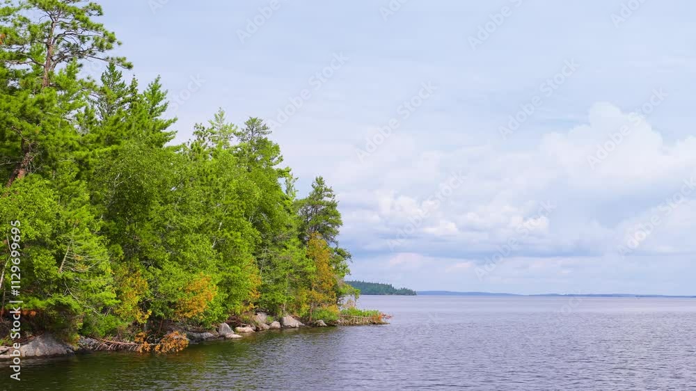 The beautiful Rainy Lake and forests of Voyageurs National Park in northern Minnesota along the border of Canada. The beautiful Rainy Lake and forests of Voyageurs National Park in northern Minnesota along the border of Canada.