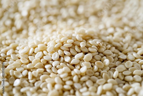 Closeup of many white sesame seeds Sesame seeds as background photo