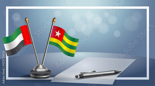 United Arab Emirate and Togo National flags on small table with bokeh background, cooperative relationship