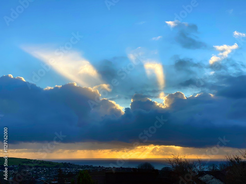 Isle of Man sunrise with stormy clouds and sun's rays