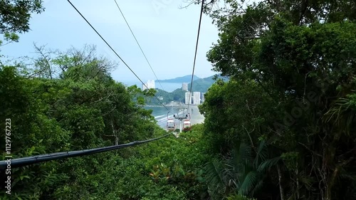 Cable car of Sao Vicente - SP, Brazil. Landscape going down the cable car with the view to Itarare Beach and Porchat Island. Coast of Sao Paulo state.