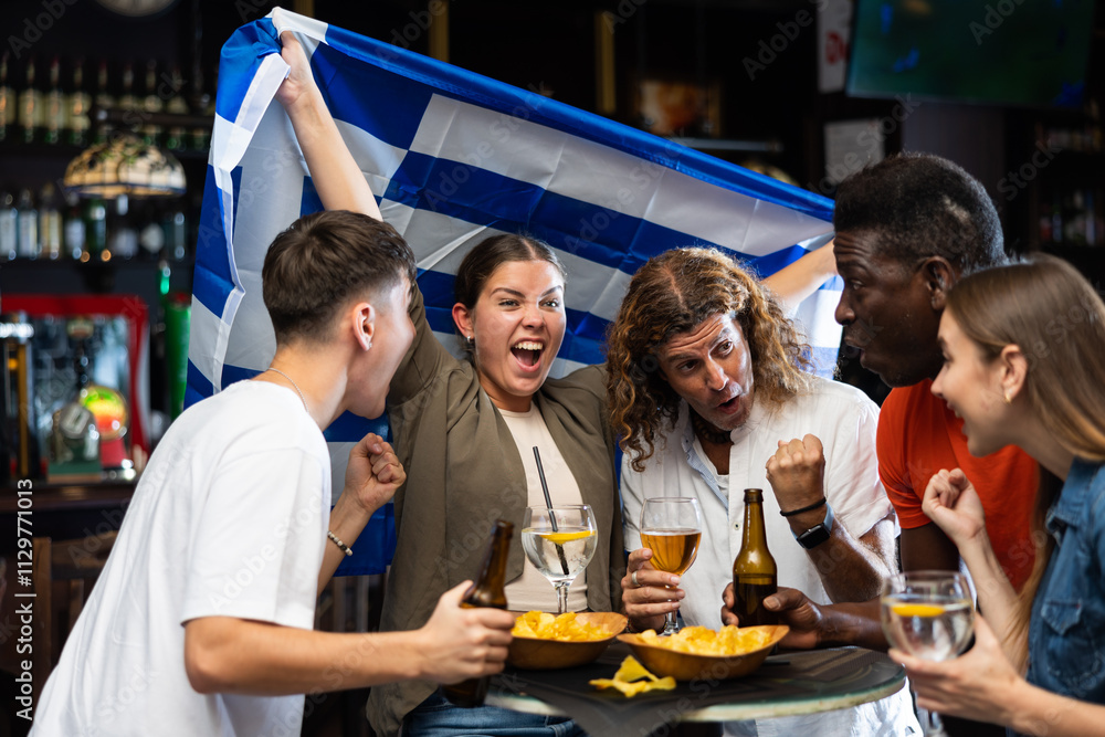 Obraz premium Enthusiastic Greek fans scream with joy in a beer bar. Greece win