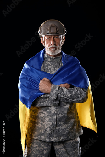 Mature soldier with flag of...