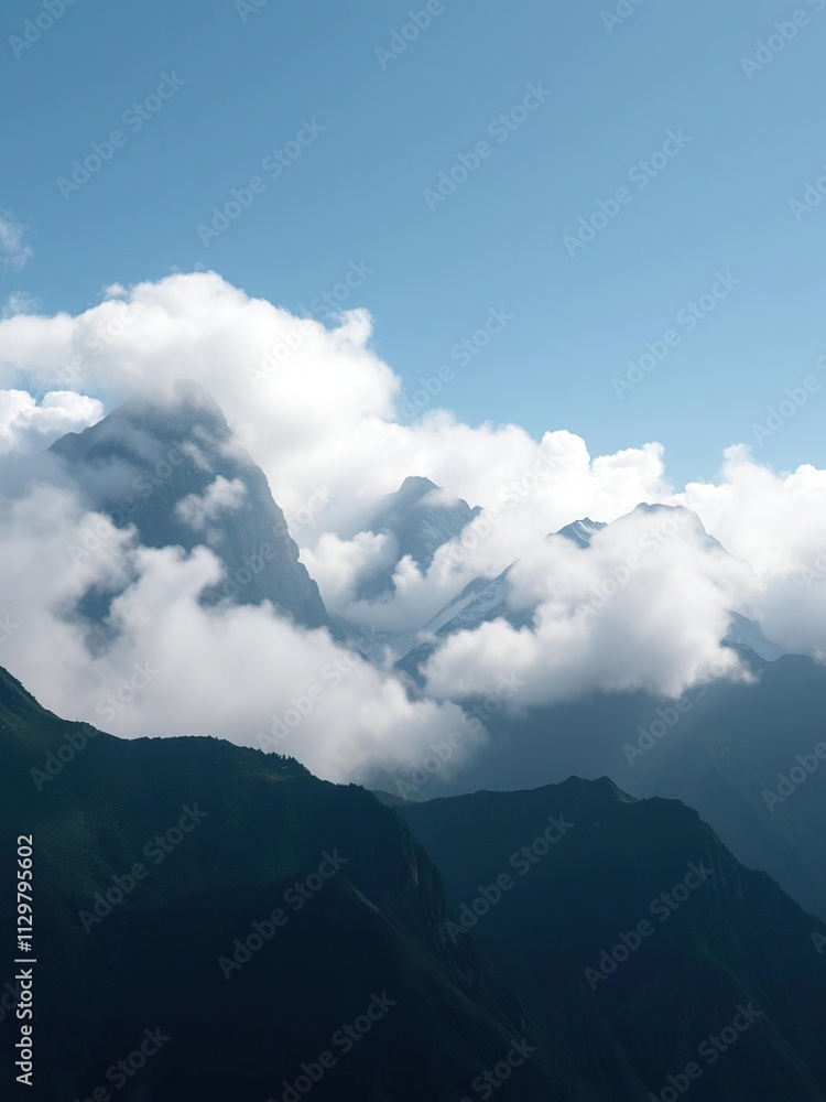 Towering mountain peaks shrouded in a blanket of mist and clouds , clouds over mountains, weather conditions Towering mountain peaks shrouded in a blanket of mist and clouds , clouds over mountains, weather conditions