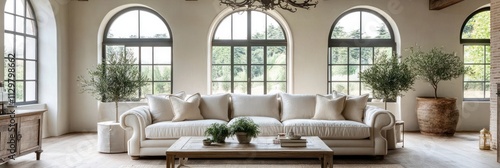 Elegant Cream Sofa In A Bright Room With Arch Windows photo