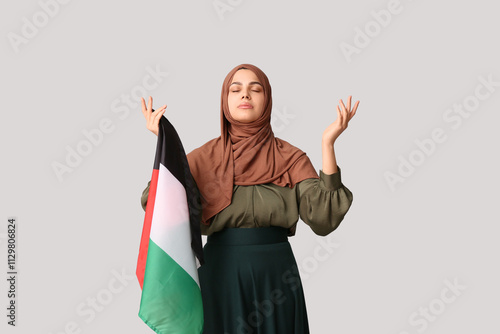 Young Muslim woman with Pal...