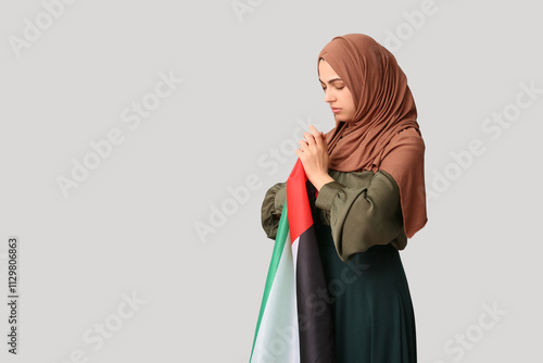 Young Muslim woman with Pal...