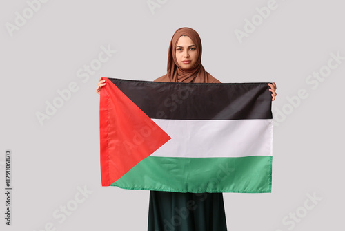 Young Muslim woman with Pal...