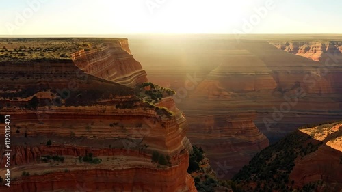 Sunlight illuminating the dramatic curves of goosenecks state park canyon showcases stunning geological formations photo