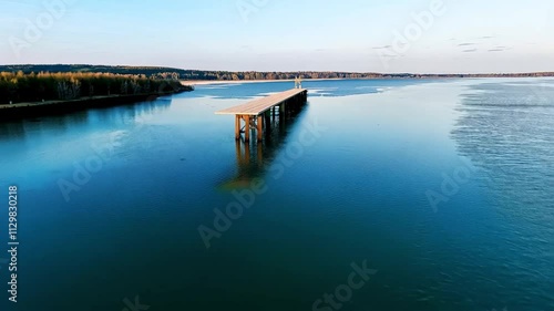 Wallpaper Mural Drone footage captures bridge construction progress, highlighting a trestle rising above a serene river, embraced by vibrant green forests Torontodigital.ca