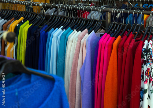 Wallpaper Mural Close up view of stand with various sweaters and cardigans in clothing shop Torontodigital.ca