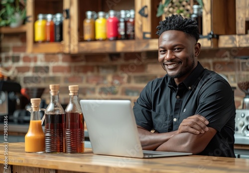 Black man is sitting at the kitchen counter with his hands crossed on top of each other