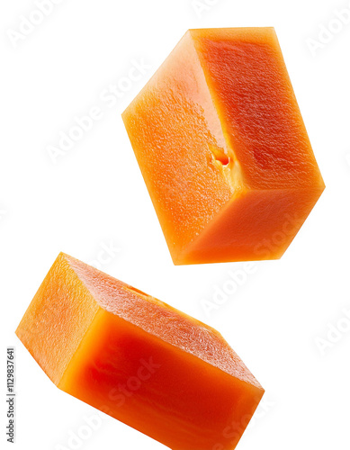 One more bright orange cube of falling papaya on white isolated with tropical appeal in full depth of field