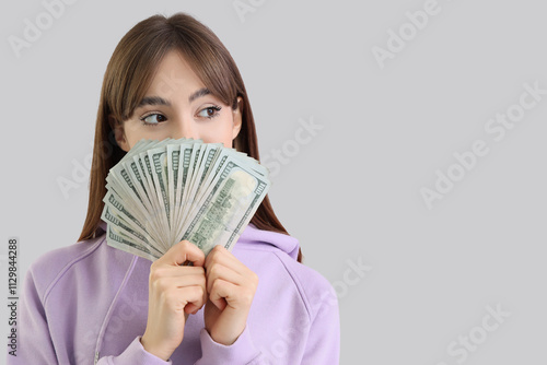 Young woman with dollar ban...