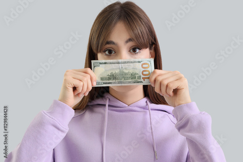 Young woman with dollar ban...