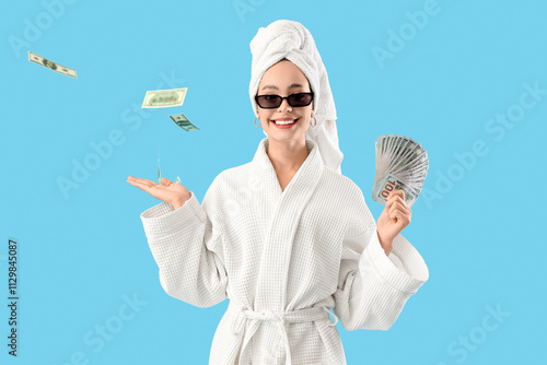 Young woman in bathrobe wit...