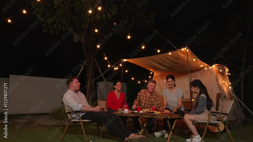 Family together celebrate holiday in garden. Family member gathering, have dinner. Outdoor camping activity to relax with nature and spend time with young generation cross generation gap. Divergence. Family together celebrate holiday in garden. Family member gathering, have dinner. Outdoor camping activity to relax with nature and spend time with young generation cross generation gap. Divergence.