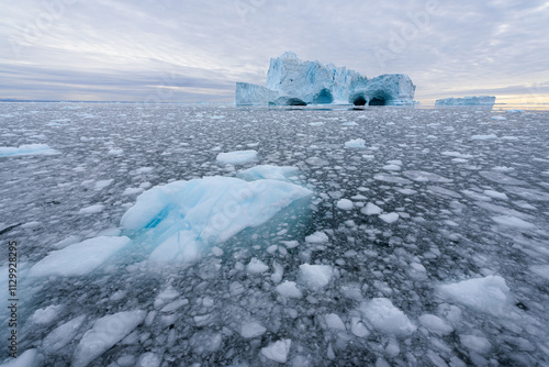 Iceberg with Caves on the Water